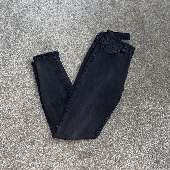 High rise, stretchy black jeans, with knee rips. - Picture 2 of 2